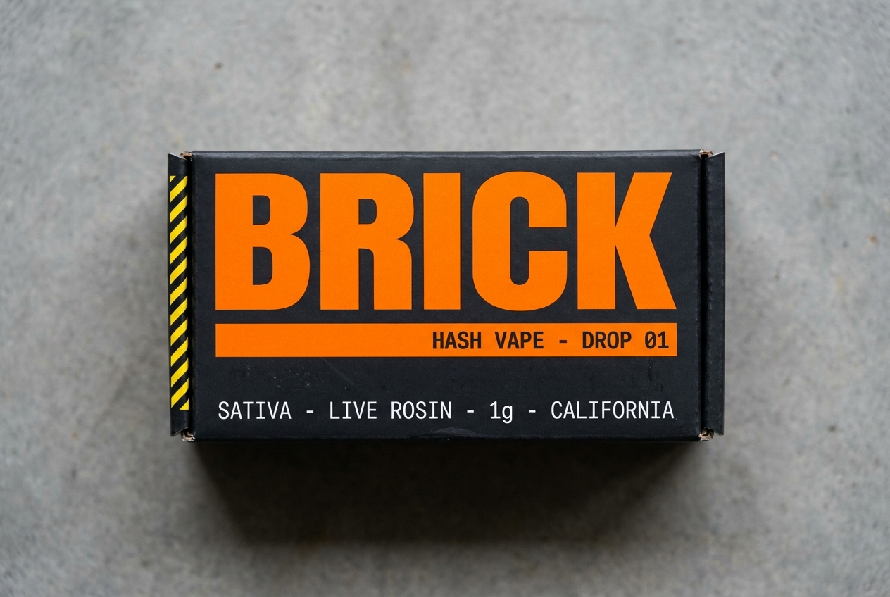 Brick product box &mdash; matte carbon black with safety orange wordmark
